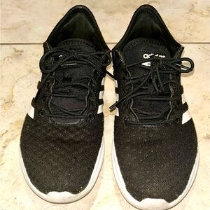 Woman’s Adidas Core Black and White Athletic Shoes